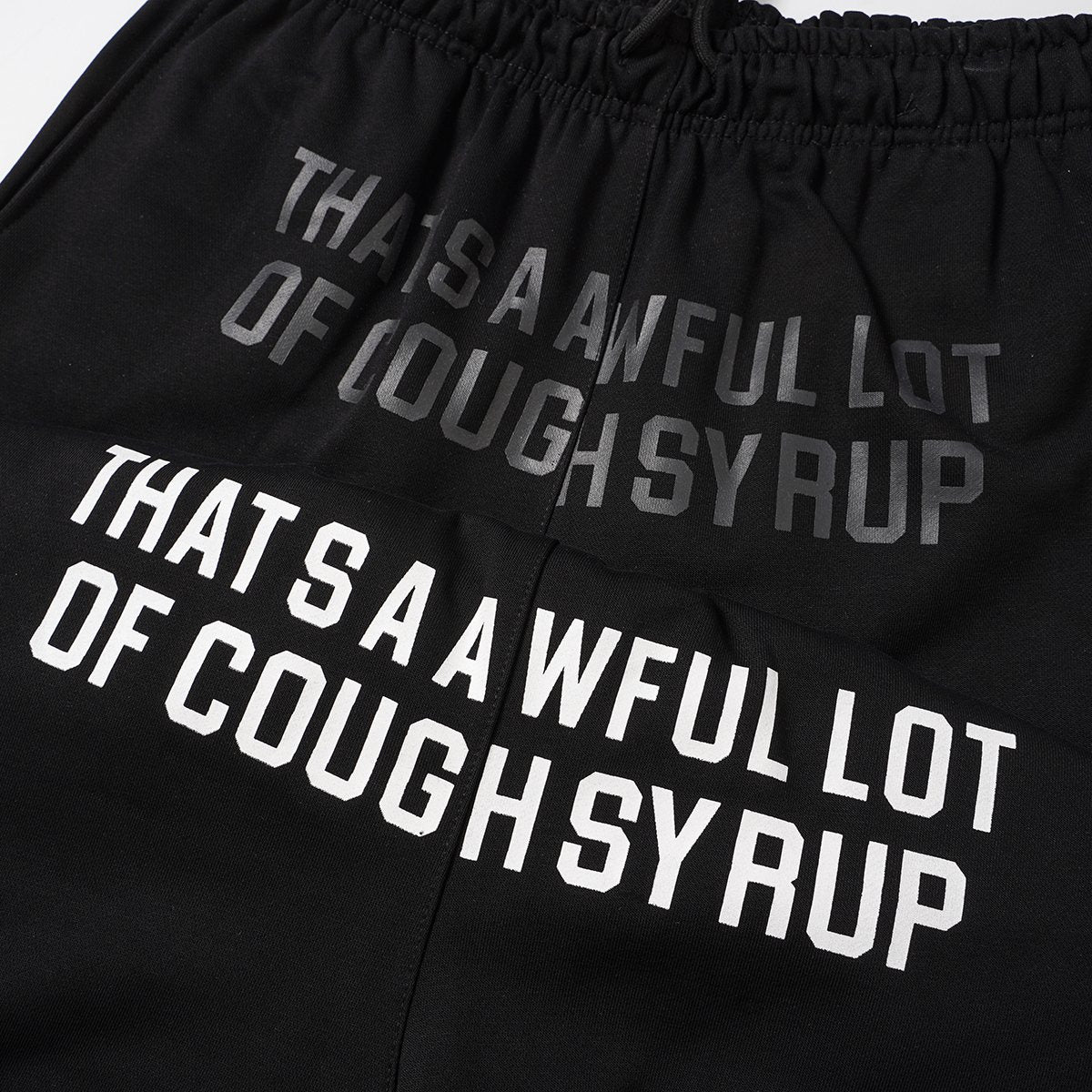THAT'S A AWFUL LOT OF COUGH SYRUP Black Graphic Shorts ¡ª detail